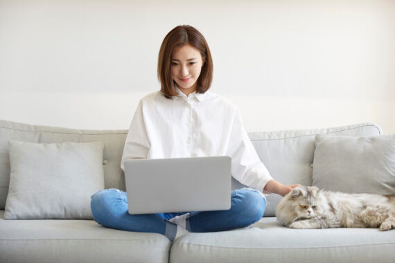 Young,Asian,Businesswoman,Working,At,Home,Using,Laptop,Computer,While